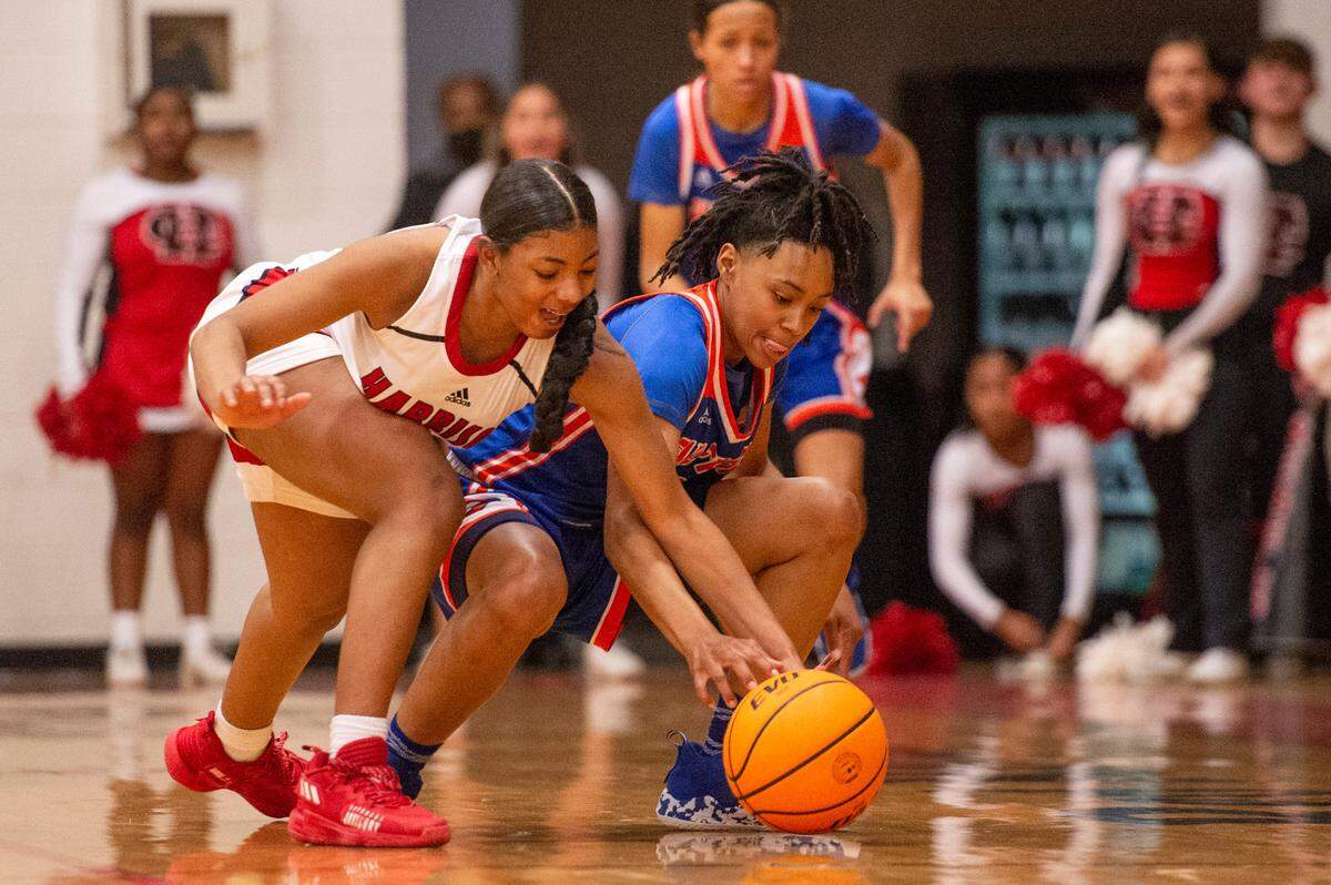 Gulfport’s Simaru Fields, right, and Harrison Central’s Shaniya Whavers fight for control of the ball during a game against Harrison Central at Harrison Central High School in Gulfport on Friday, Feb. 4, 2022.