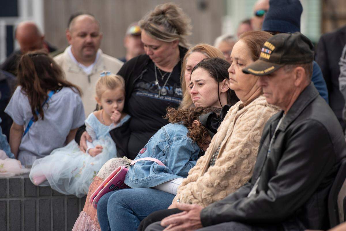Members of Steven Robin’s family during a ceremony dedicating commemorative stars in honor of Sergeant Steven Robin and Officer Branden Estorffe outside the new Bay St. Louis Police Department in Bay St. Louis on Thursday, Dec. 14, 2023.
