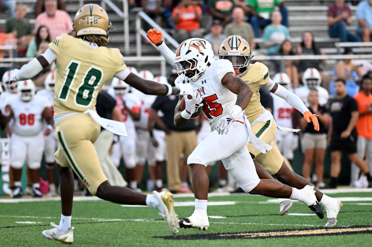 West Harrison running back Jordan Stapleton (45) picks up yards Friday in West Harrison’s win over Poplarville.