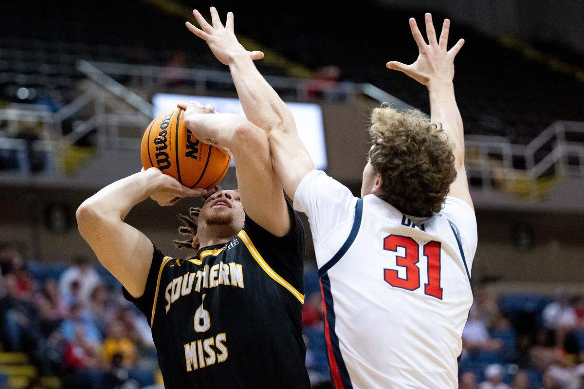 Southern Mississippi guard Robert Cowherd (6) looks for a shot Saturday.