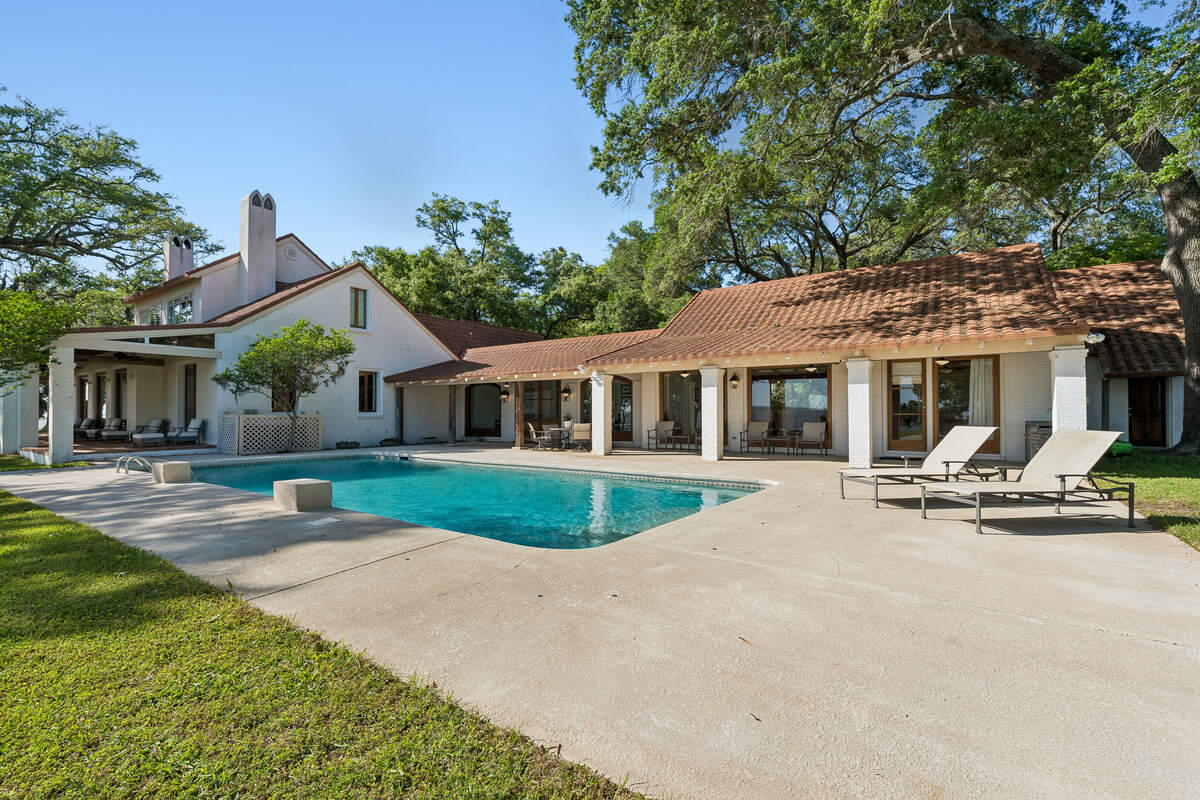 This photo shows one of two pools on Ocean Springs property listed at $7 million. The waterfront property also includes a second luxurious home with a swimming pool.