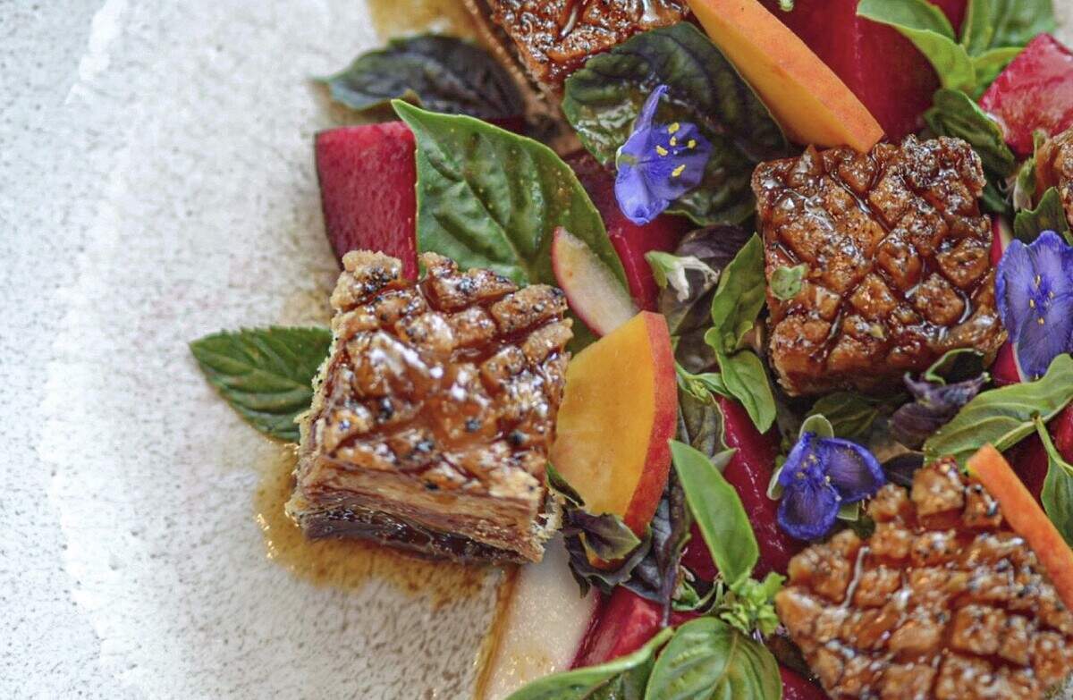 Radish’s seared pork belly dish, which is served with pickled peach mustard and southern pecan BBQ sauce.