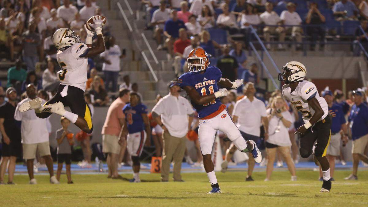 Oak Grove cornerback Jaylen Knight intercepts a Gulfport pass in their 37-13 win over the Admirals Sept. 6, 2019.