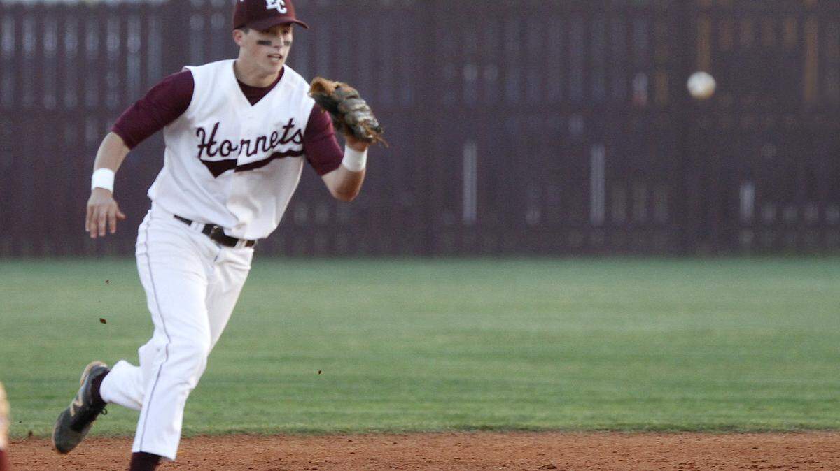 TIM ISBELL/SUN HERALDEast Central shortstop Reis Trager charges a ground ball against Vancleave, Friday, Apr. 8, 2016. 