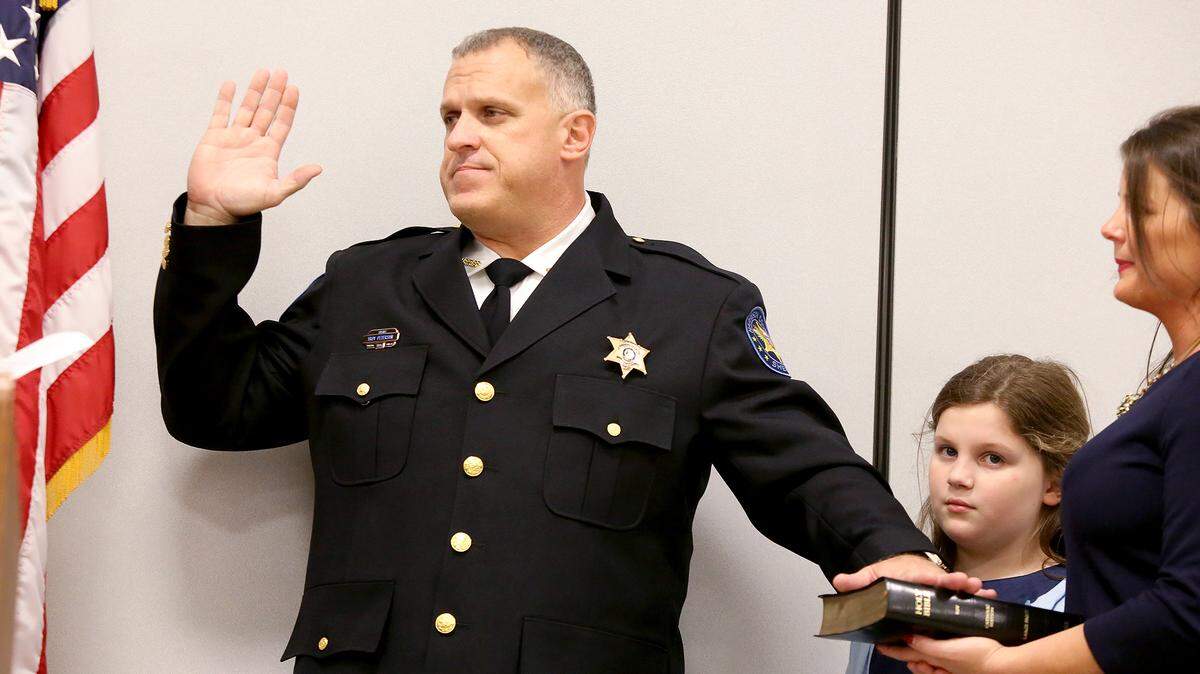 AMANDA McCOY/SUN HERALDHarrison County Sheriff Troy Peterson is sworn in by Judge Chris Schmidt during a ceremony on Monday, January 3, 2016, at the Lyman Community Center in Gulfport.