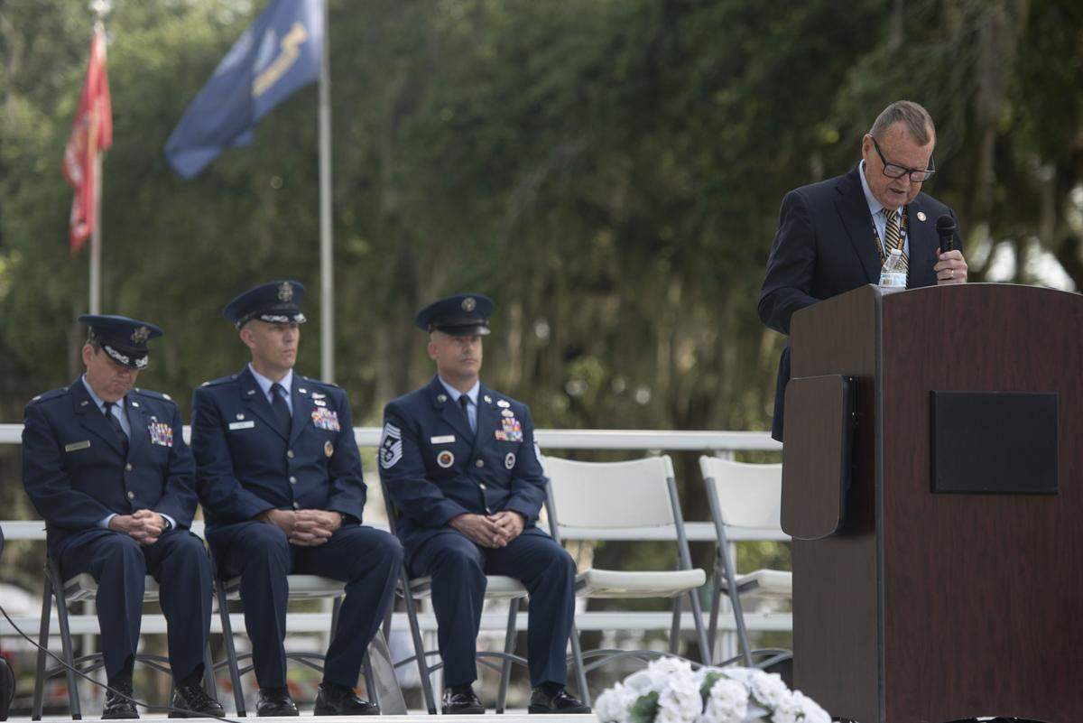 Michael Leonard, Chief Administrative Officer for the city of Biloxi, leads a Memorial Day ceremony at Biloxi National Cemetery in Biloxi on Monday, May 26, 2025.