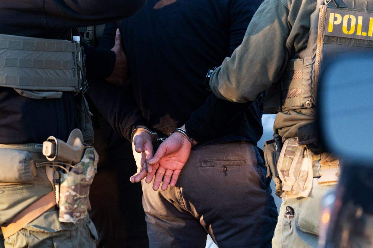 Immigration and Customs Enforcement (ICE) agents apprehend an undocumented migrant they were surveilling in Herndon, VA, Jan. 15, 2025.