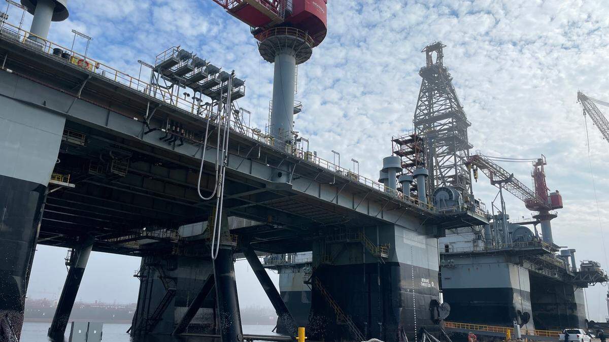 Crews work to prepare oil platforms to be moved from Pascagoula Thursday. Space X had planned to use the platforms to use as launch pads.