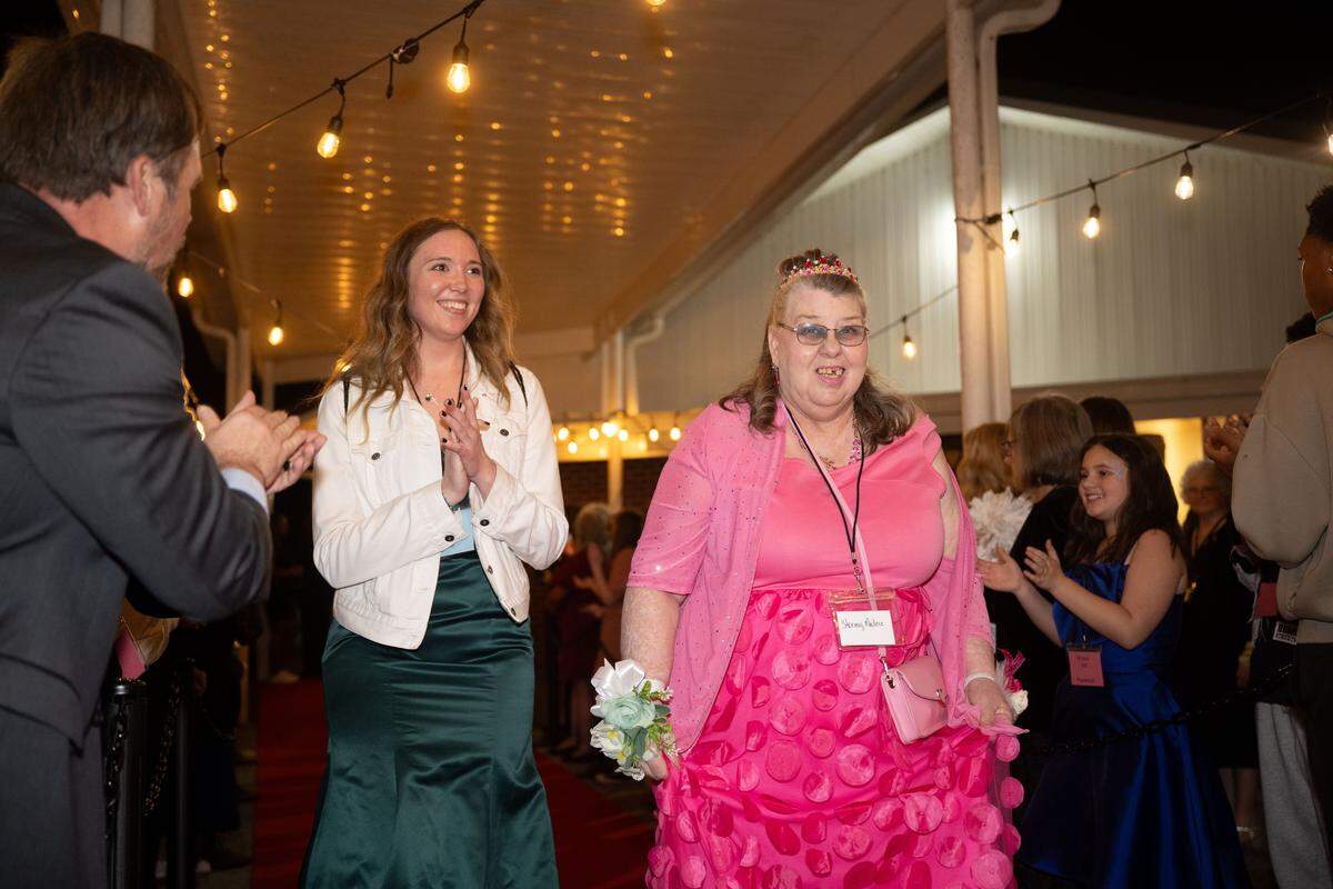 Stormy Madere walks the red carpet during Night to Shine at Woolmarket Baptist Church on Friday, Feb. 13, 2026.