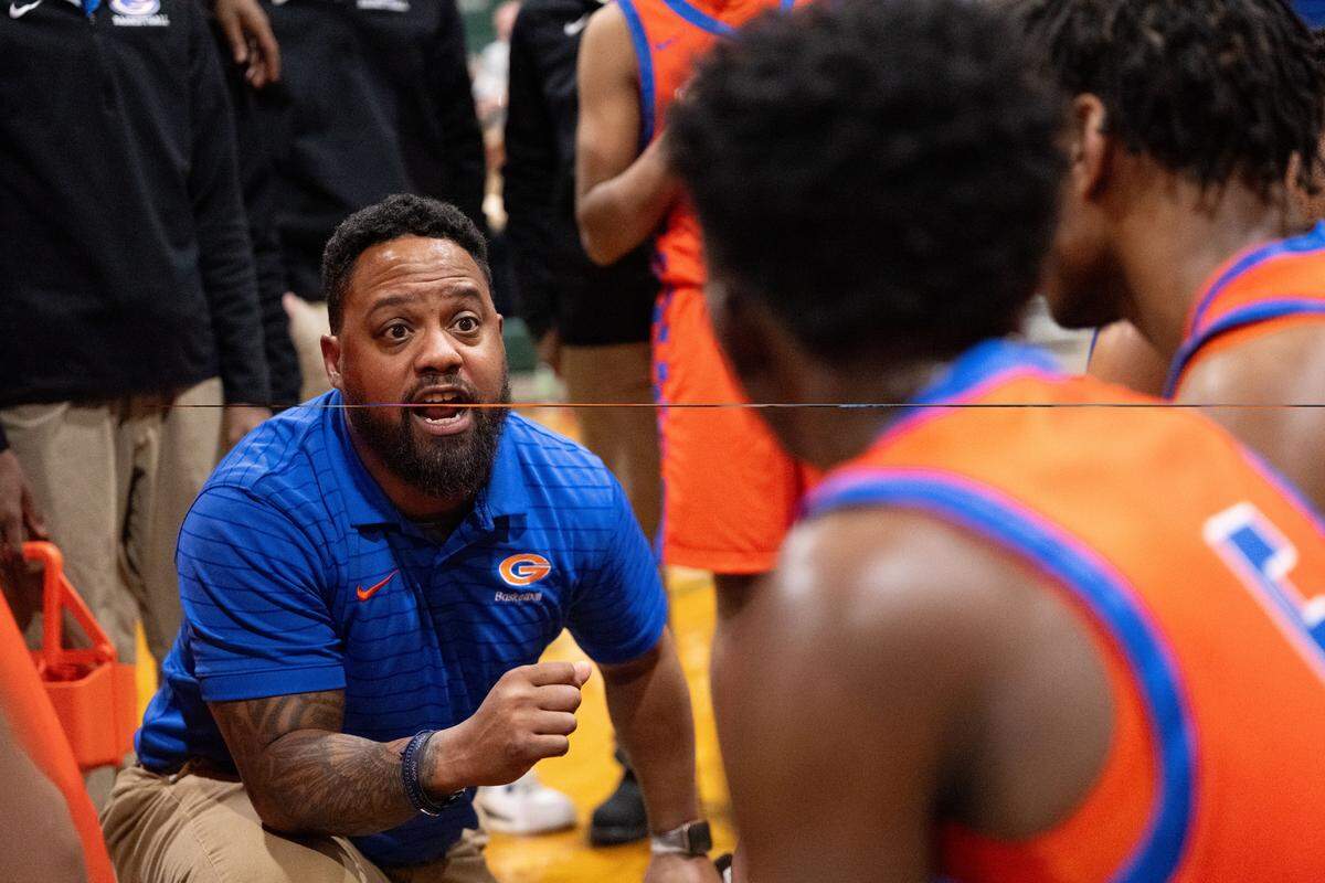 Gulfport head coach Brian Butler speaks with his players during a basketball game at West Harrison High School on Tuesday, Jan. 13, 2026.