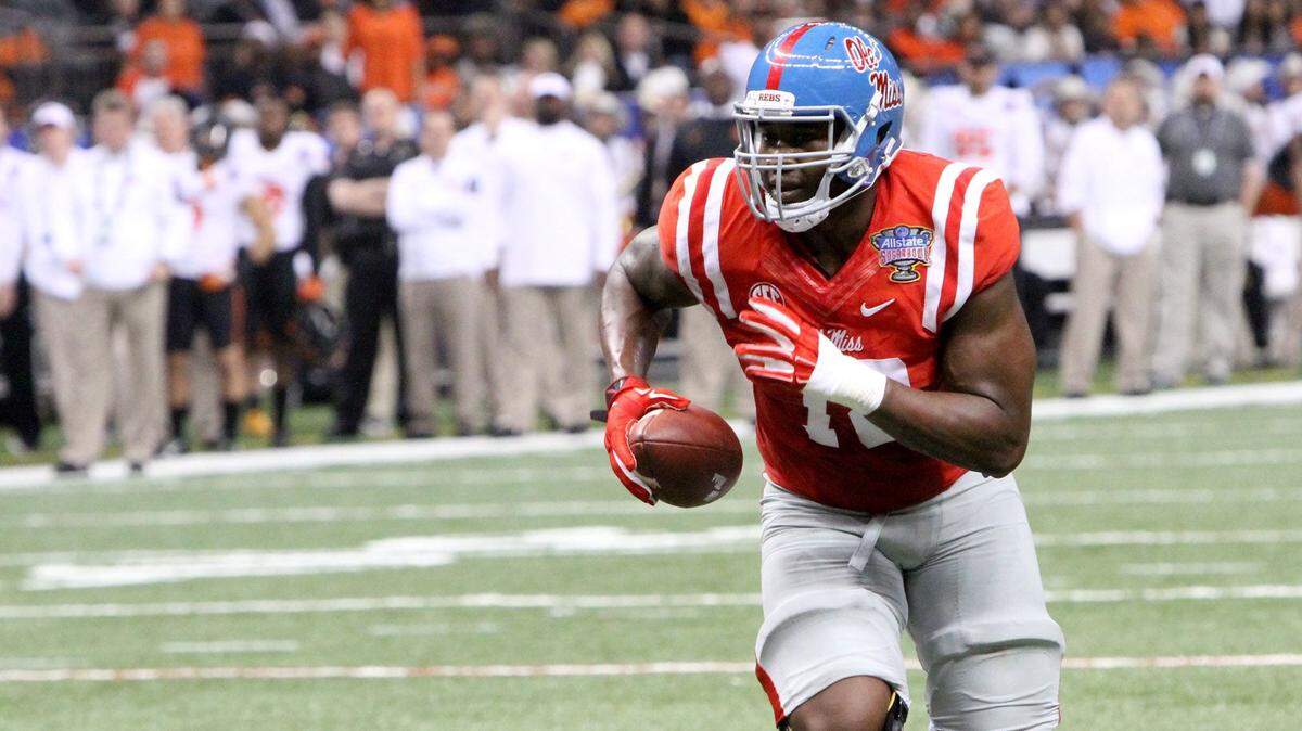 TIM ISBELL/SUN HERALD 
 Laremy Tunsil of Ole Miss scores on a tackle eligible play in the closing seconds of the first half during the All State Sugar Bowl in New Orleans, Friday, Jan. 1, 2016.