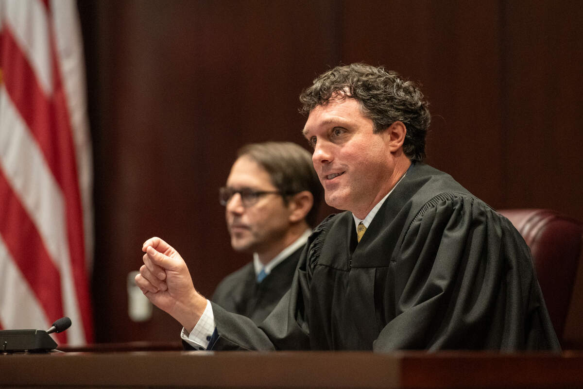 U.S. District Judge Taylor McNeel presides over a naturalization ceremony for 25 new American citizens at Dan M. Russell Courthouse in Gulfport on Thursday, Oct. 19, 2023.