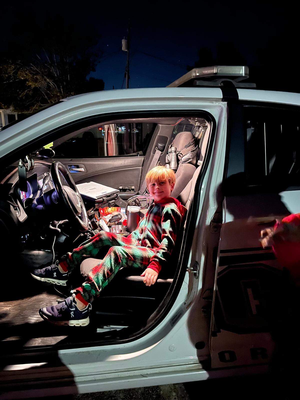 After saving their elves from jail, the Titus children of Gulfport got to turn on the lights and check out Gulfport Police Officer Matthew Mashburn’s patrol car. Sawyer Titus, 7, is shown in the driver’s seat.