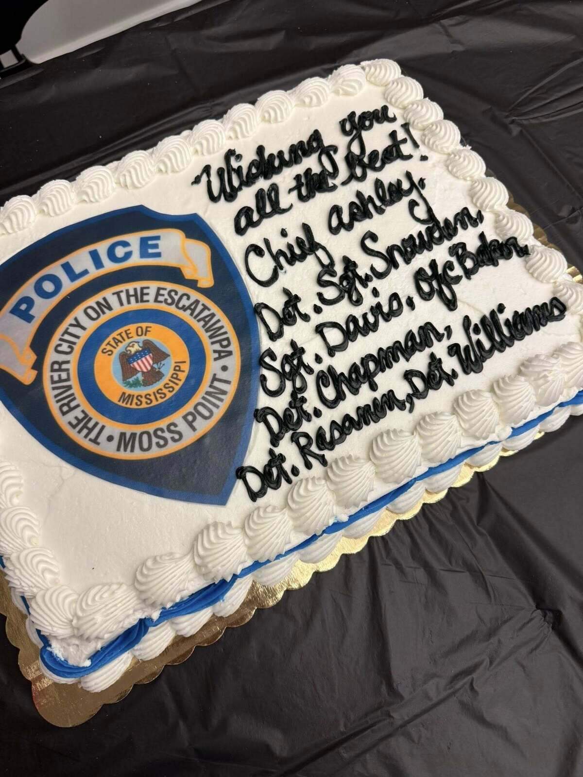 Former Moss Point police officers purchased a cake to honor former Chief Brandon Ashley on his last day on the job and their last day on the job on Oct. 3, 2025.