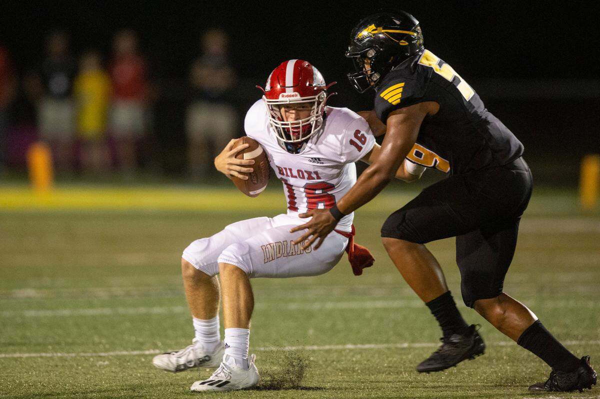 Biloxi quarterback Zachary Marlin gets sacked by D’Iberville during a game at Warriors Stadium in D’Iberville on Friday, Sept. 23, 2022.
