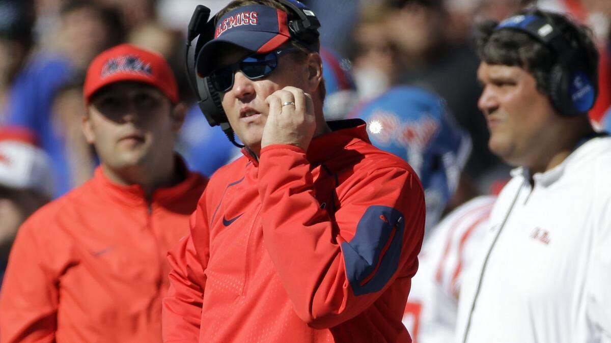 MARK HUMPHREY/ASSOCIATED PRESSOle Miss head coach Hugh Freeze, center, watches from the sideline as Memphis upset the No. 13 Rebels 37-24.