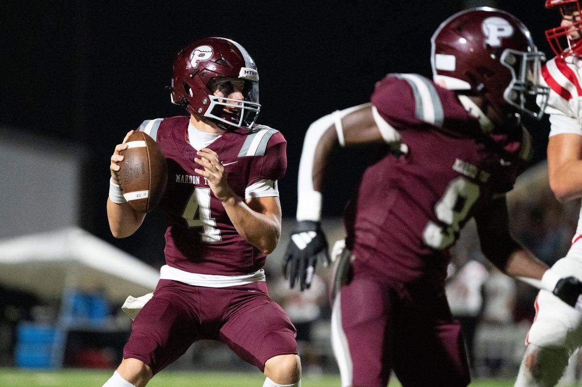 Picayune quarterback Colt Robertson (4) looks for an open receiver Friday.