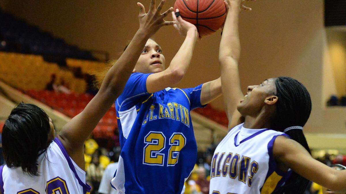 BOB SMITH/SPECIAL TO THE SUN HERALD 
 St. Martin's Savannah Jones (22) shoots against Columbus during Girls MHSAA 6A Quarterfinal play at Jackson State University in Jackson.(Photo-Bob Smith)