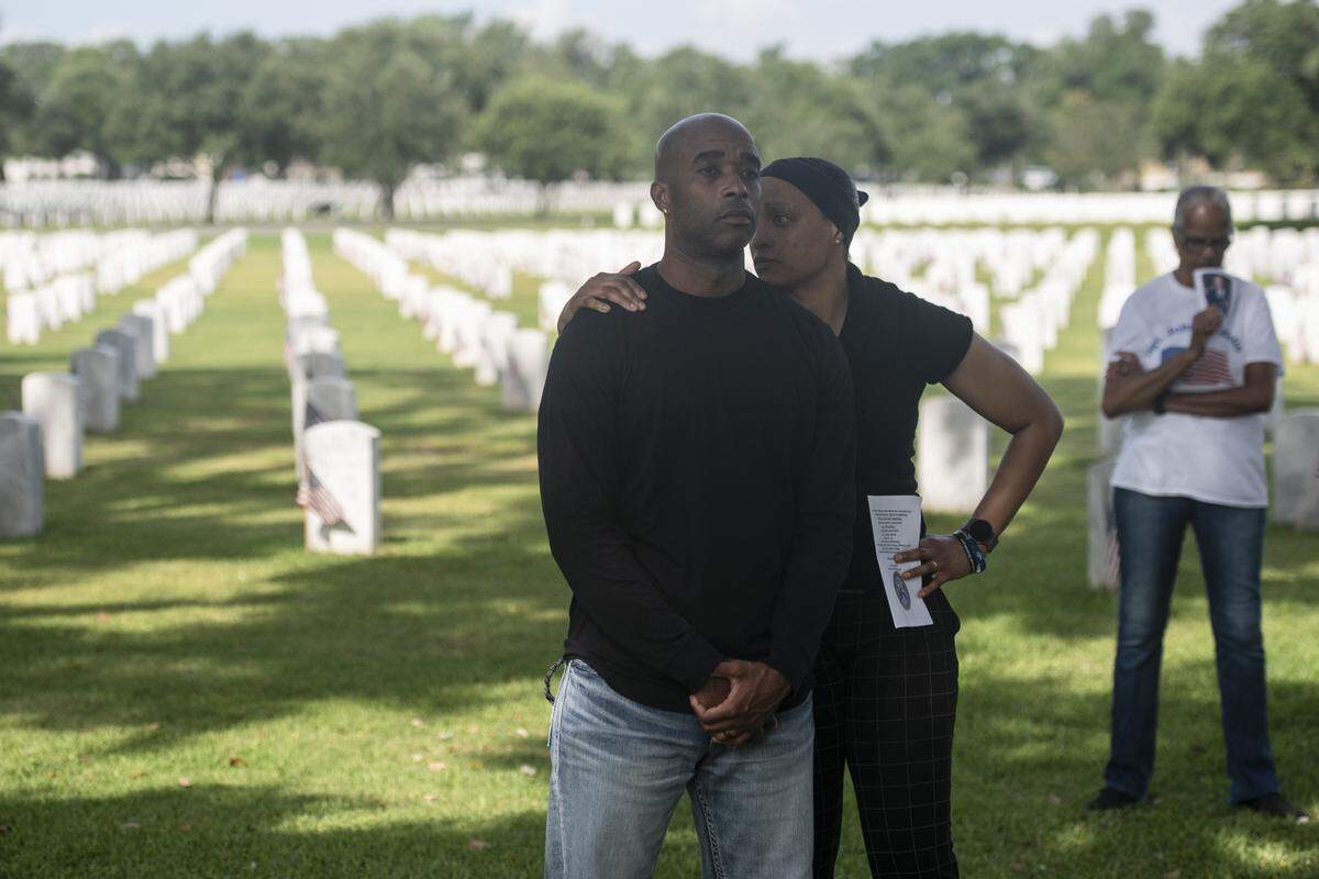 Members of the public listen during a Memorial Day ceremony at Biloxi National Cemetery in Biloxi on Monday, May 26, 2025.