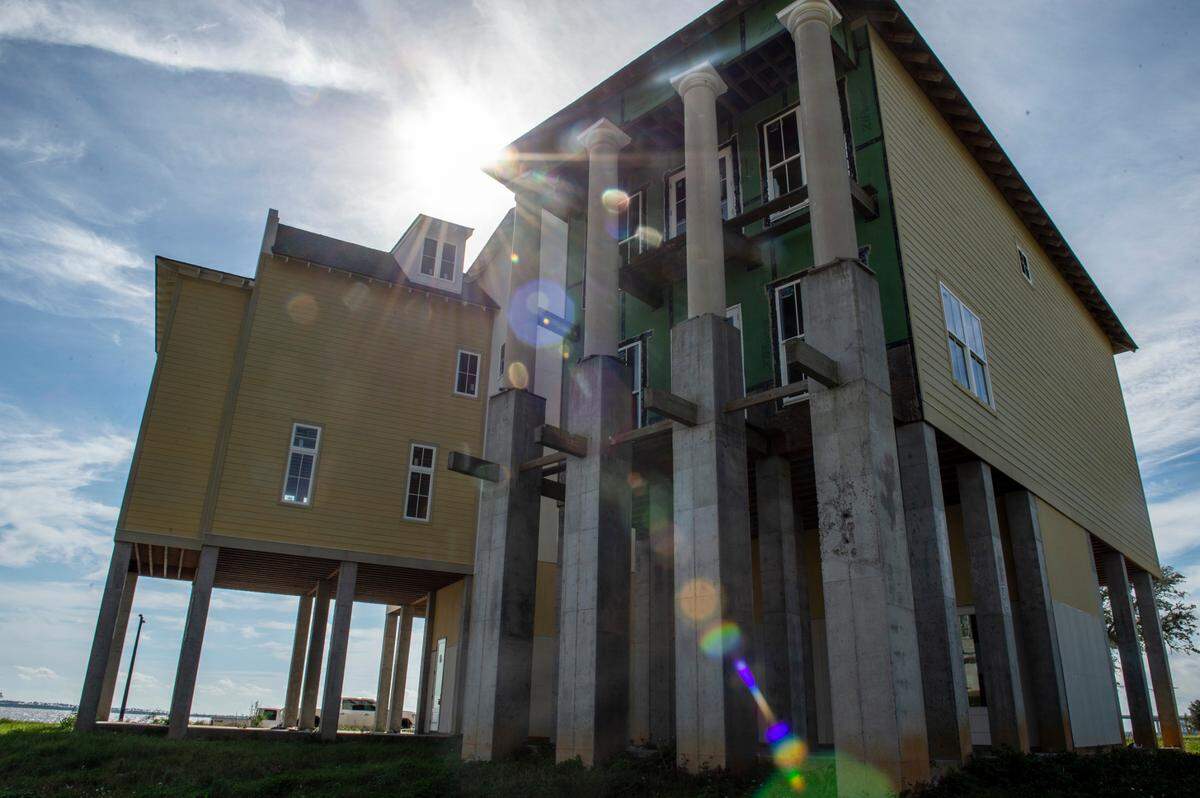 Two homes built as a part of The Sands development in Ocean Springs on Thursday, Oct. 14, 2021.