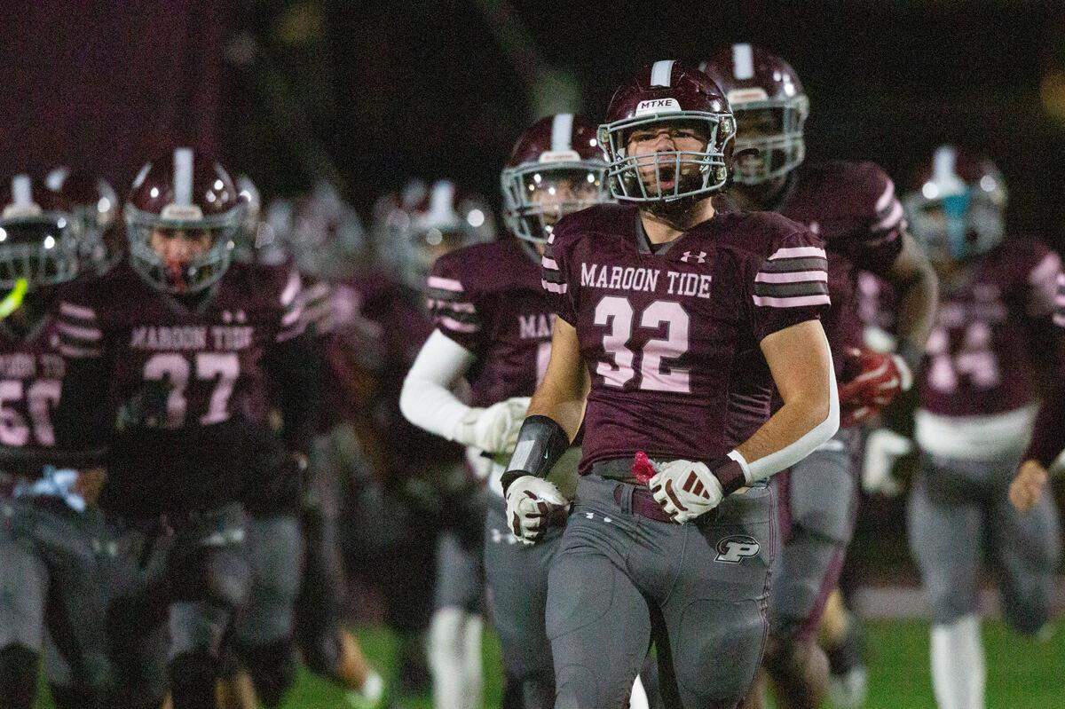 Picayune runs onto the field before a playoff game between Picayune and George County at Lee-Triplett Stadium in Picayune on Friday, Nov. 22, 2024.
