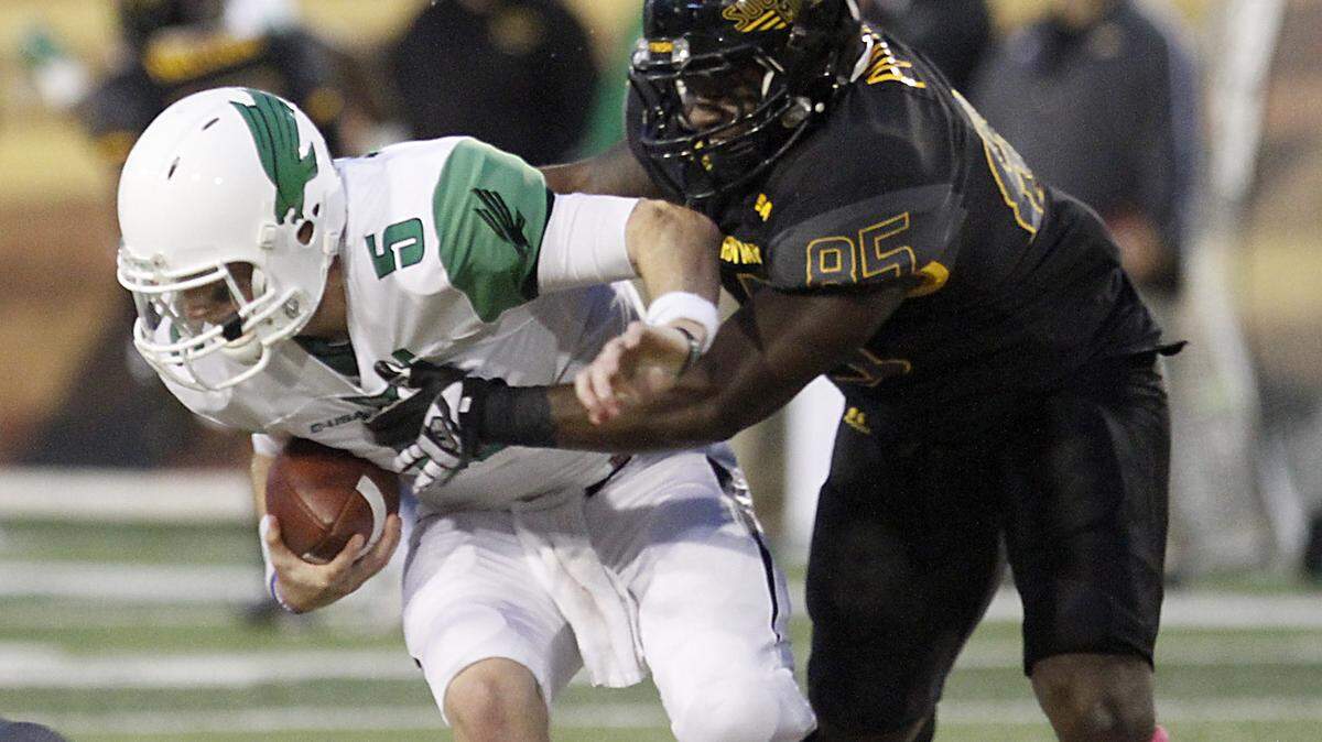 TIM ISBELL/SUN HERALD 
 Southern Miss defensive lineman Ja'Boree Poole sacks North Texas quarterback Andrew McNutty on Oct. 3 in Hattiesburg.