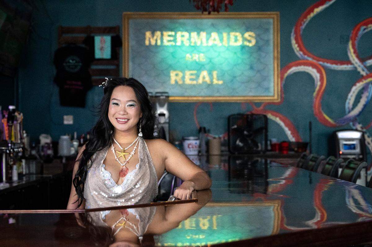 Bartender Jennifer Quach, right, poses for a portrait at The Mermaid Dive Bar, where she works, in Biloxi on Wednesday, June 25, 2025.