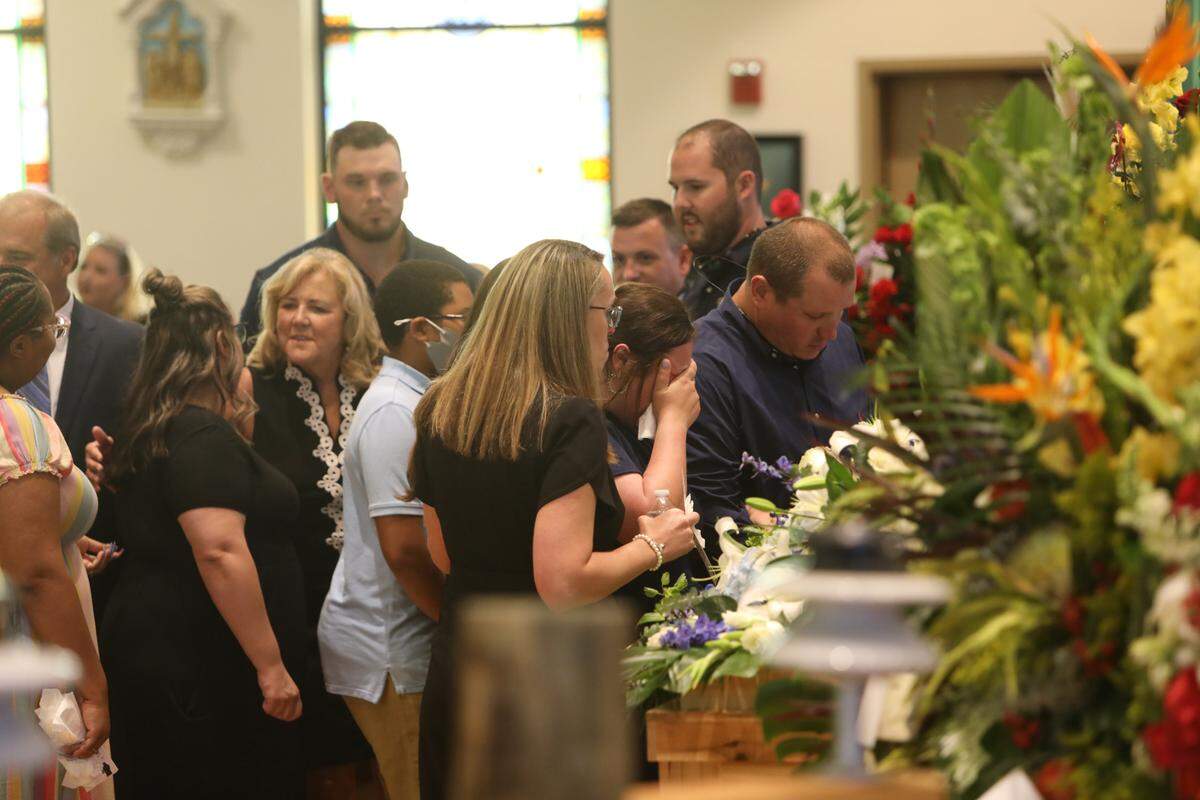 Guests say goodbye to Cayce Seal, 28, during his funeral service at St. Clare Catholic Church in Waveland on July 1, 2021.