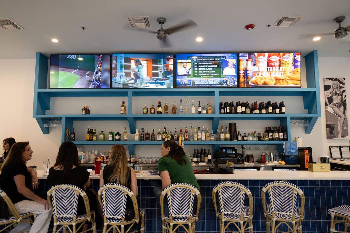 Visitors sit at the indoor bar at Bacchus on the Bluff in Gulfport.