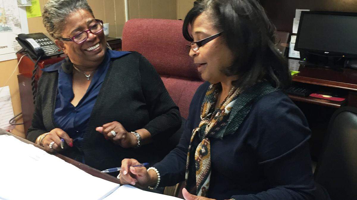 G. TREMAIN MERRELL/SPECIAL TO THE SUN HERALDJanice Green-Merrell and Yolanda Lewis of the Harrison County Senior Services Agency review spreadsheets for a final confirmation.