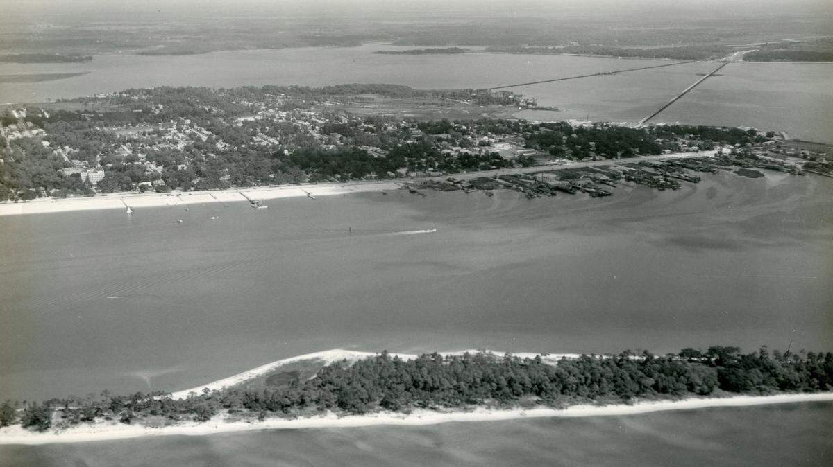 SUN HERALD FILE/AUDREY MURPHYDeer Island, not far from the Biloxi and Ocean Springs mainlands, has long been an island of mystery and tales of pirates, campers and ghosts. Audrey Murphy, a mid-20th century Biloxi photographer, captured this image of Deer Island before Hurricane Camille and other storm and natural erosion changed its number of trees.