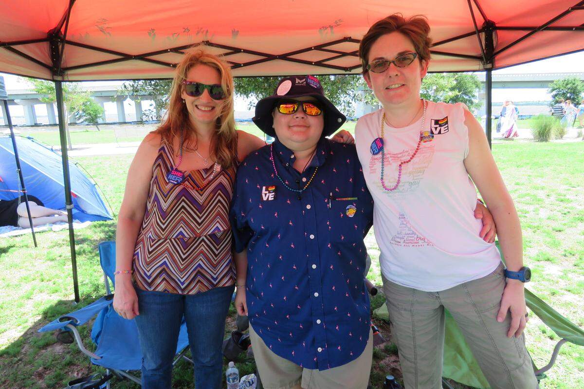 Stacey Curry, Regina L. Rhodes and Megan Craven represent First Christian Church (Disciples of Christ) in Gulfport at Pride Day in Biloxi on June 26, 2021.