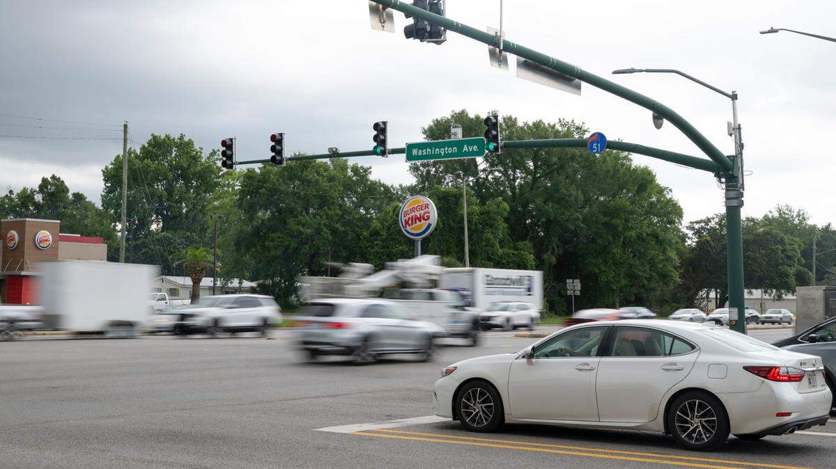 Cameras at the intersection of Bienville Boulevard and Washington Avenue in Ocean Springs on Tuesday, June 17, 2025. While Securix cameras no longer record license plates to cite uninsured vehicle owners, the Mississippi Department of Transportation has a live traffic camera at the intersection and there’s a Flock camera for public safety.