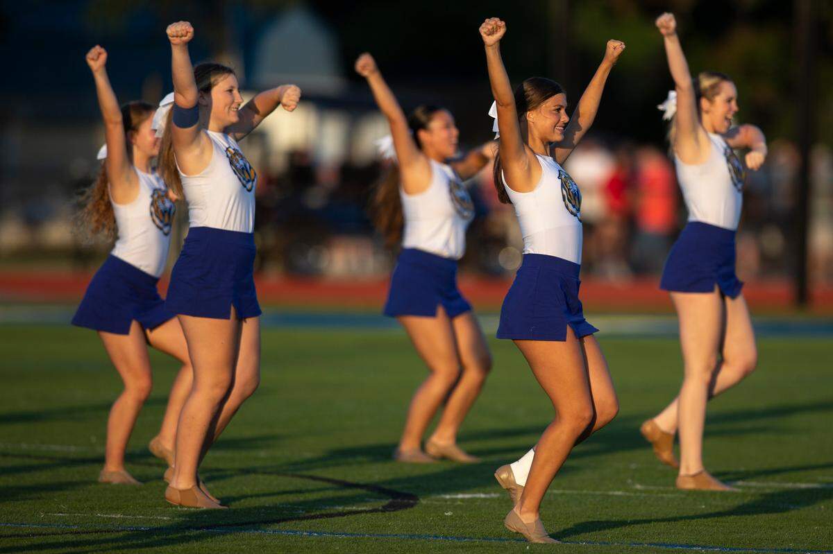 Bay High cheerleaders cheer on the Tigers at Bay High in Bay St. Louis on Friday, Sept. 1, 2023.