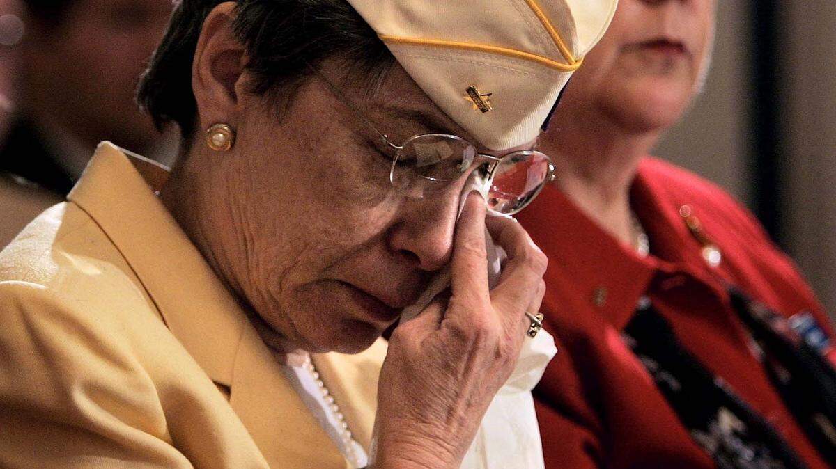 ASSOCIATED PRESS/FILEEdith Smith, legislative committee member for Gold Star Wives of America, cries as she listens to testimony in 2005 of fellow witnesses during a hearing on military death benefits before the Senate Veterans Affairs committee in Washington.