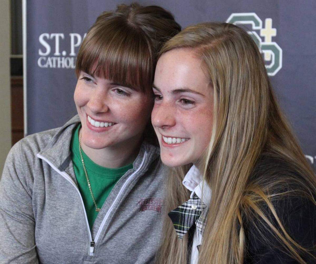 JOHN FITZHUGH/SUN HERALD St. Patrick Catholic High School student Ramsey Wagner, right poses with her sister, Hannah, on Friday Feb. 19, 2016 after signing to accept her appointment to the United States Military Academy at West Point, where she will run cross country and track.