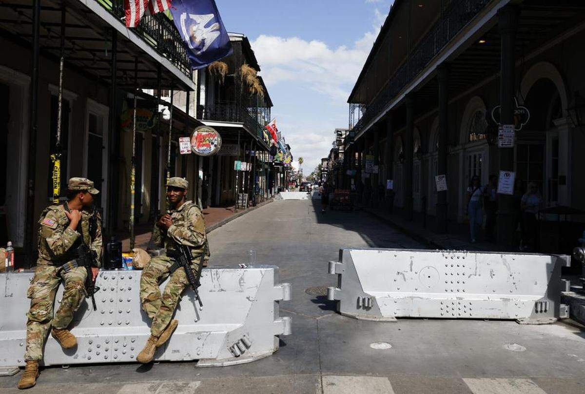 Louisiana National Guard sit on a barricade on Bourbon Street ahead of Super Bowl LIX in New Orleans on Feb. 5, 2025.