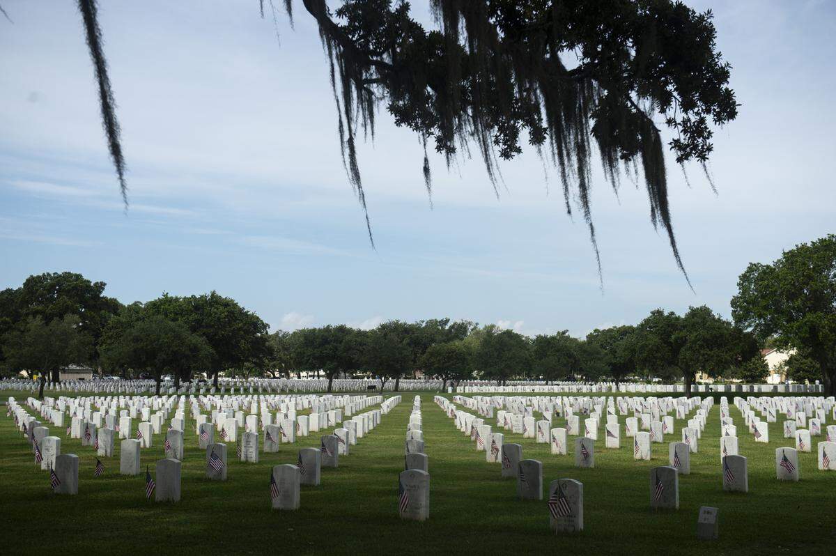 American flags decorate the headstones at Biloxi National Cemetery in Biloxi for Memorial Day on Monday, May 26, 2025.