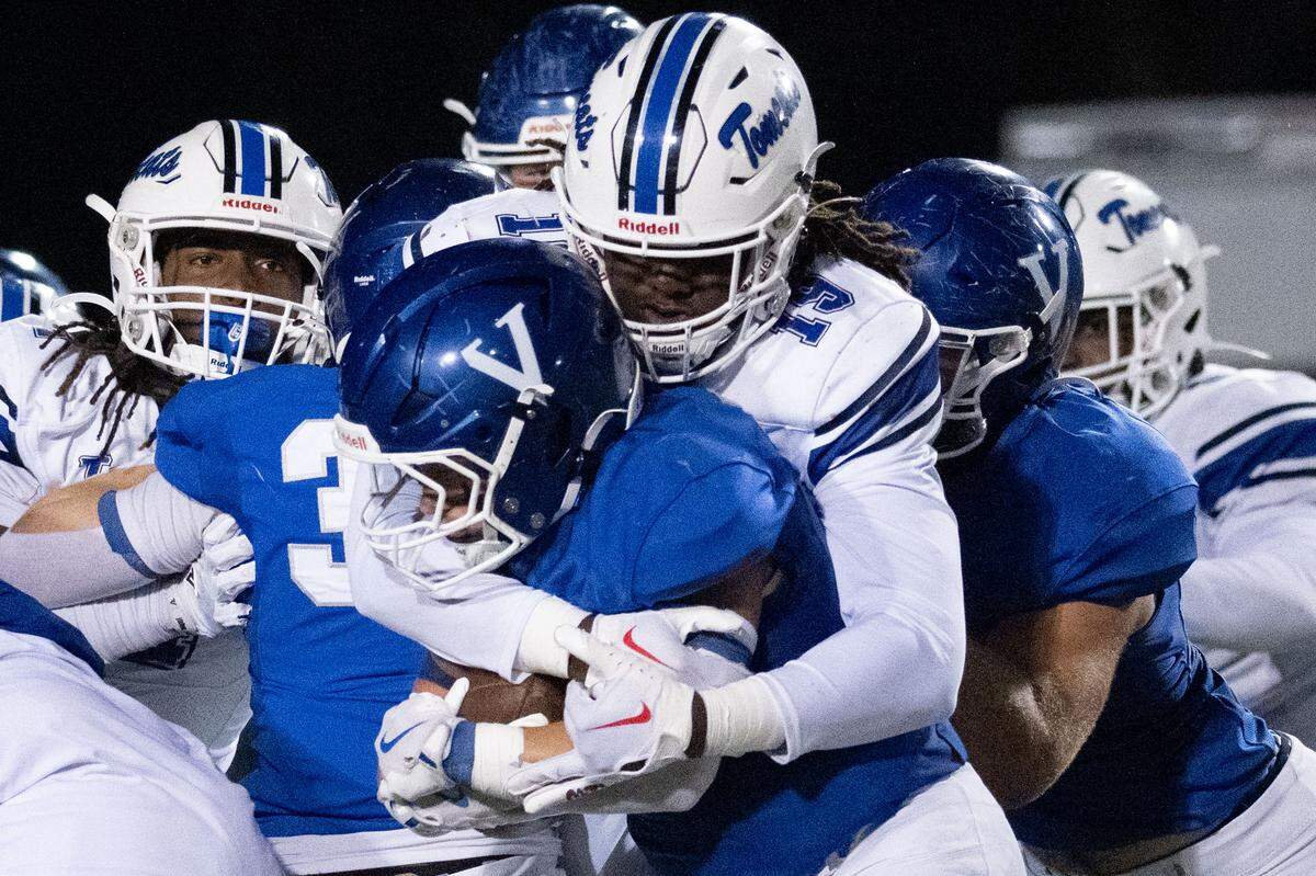 Stone defensive end Tariq Noel (19) wraps up a ballcarrier Friday in the Tomcats’ win over Vancleave.