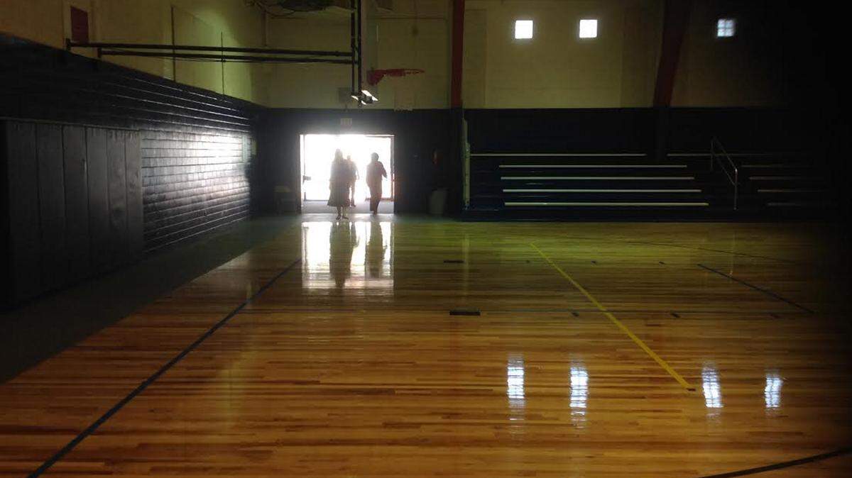 KAREN NELSON 
 
 Ocean Springs Mayor Connie Moran and School Board President Sue White take a look at the Taconi Gym, the city took possession of this week. The city paid to have the floors redone for $16,000 in the fall.