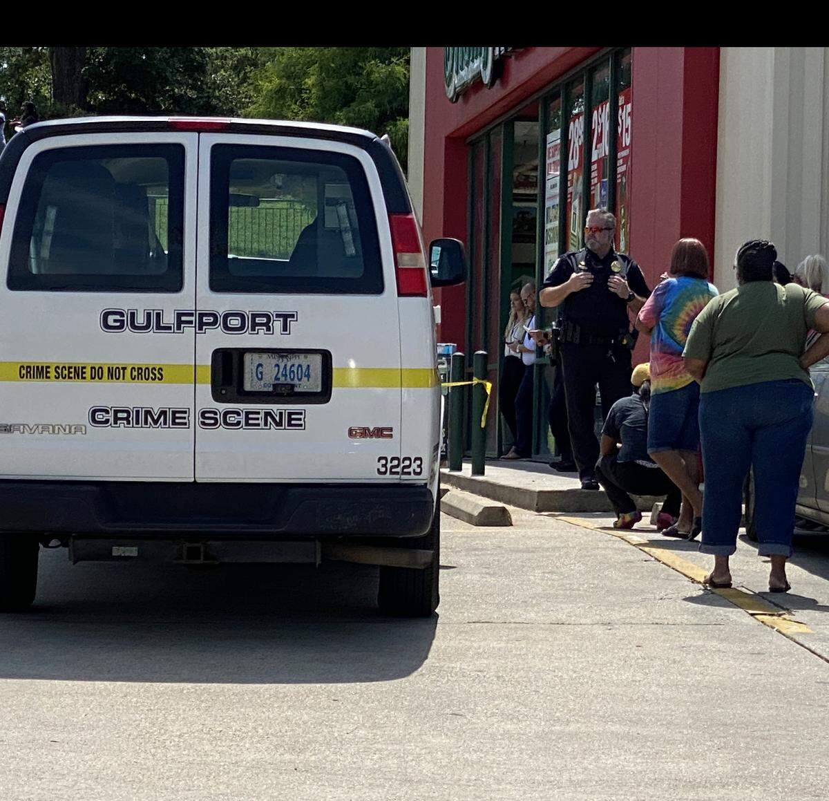 Friends and family of a man shot outside O’Reilly Auto Parts on Dedeaux Road in Gulfport on Monday, June 14, 2021, talk to Gulfport police.