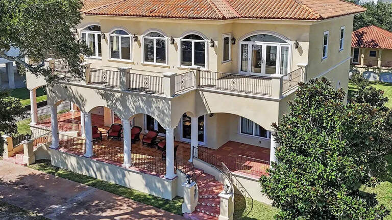 This Mediterranean-style villa is unlike most Coast mansions. And it can be yours