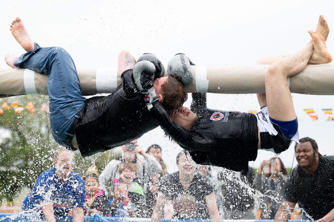 Attendees participate in Thai water boxing during Songkran at the Wat Buddhametta Mahabaramee in Gautier on Sunday, April 19, 2026.