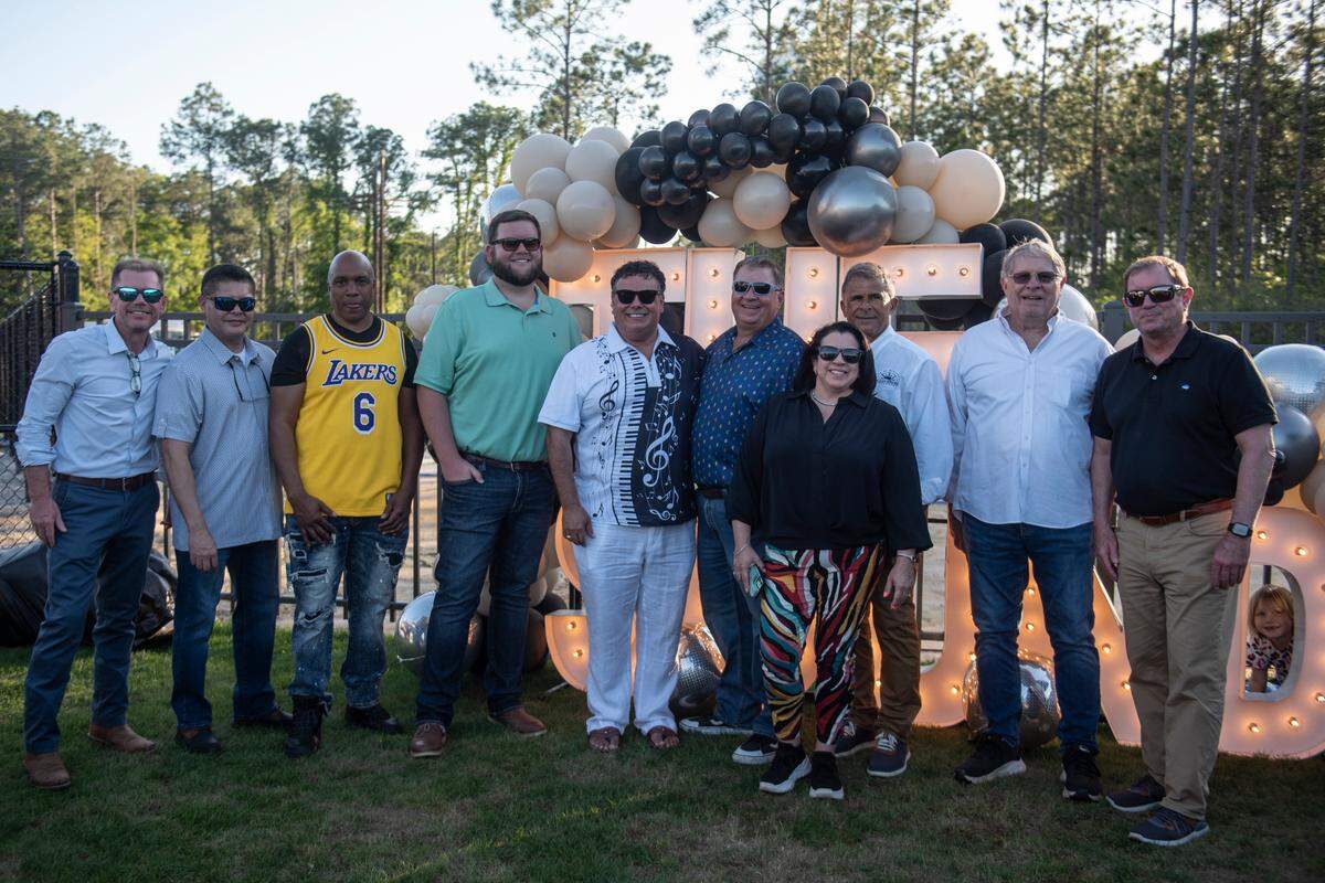 City leaders from Gautier and Ocean Springs, including Gautier Mayor Casey Vaughn and Ocean Springs Mayor Kenny Holloway pose for a photo before the inaugural show at The Sound Amphitheater in Gautier on Friday, April 12, 2024.