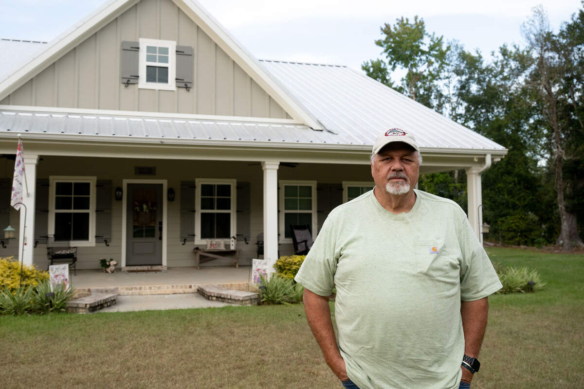 Clark Breland stands in front of his new house in Kiln on Wednesday, Sept. 17, 2025.