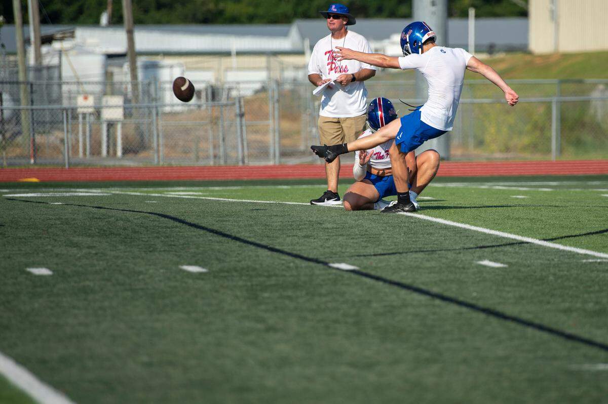 Pass Christian football players practice on a turf field at Francis McDonald Stadium in Pass Christian on Tuesday, Aug. 1, 2023.