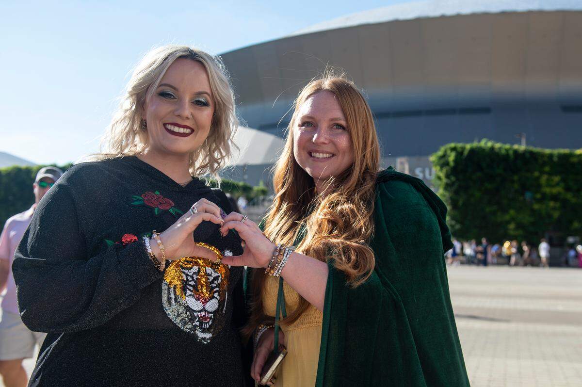 Krislyn Branford and Lauren Gaters pose for a photo outside the Cesars Superdome in New Orleans on Friday, Oct. 25, 2024, before Taylor Swift’s Eras Tour performance that night.