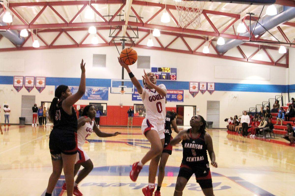 Pascagoula Panther Ashanti Moore drives to the hoop in a basketball game