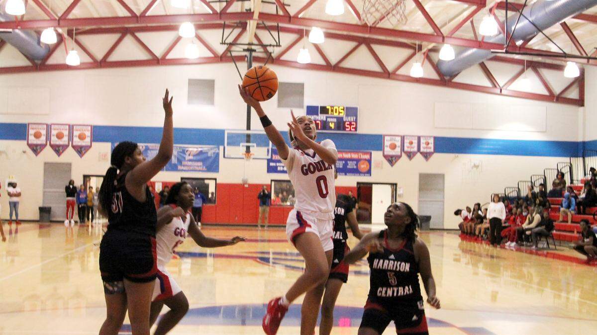 Pascagoula Panther Ashanti Moore drives to the hoop in a basketball game