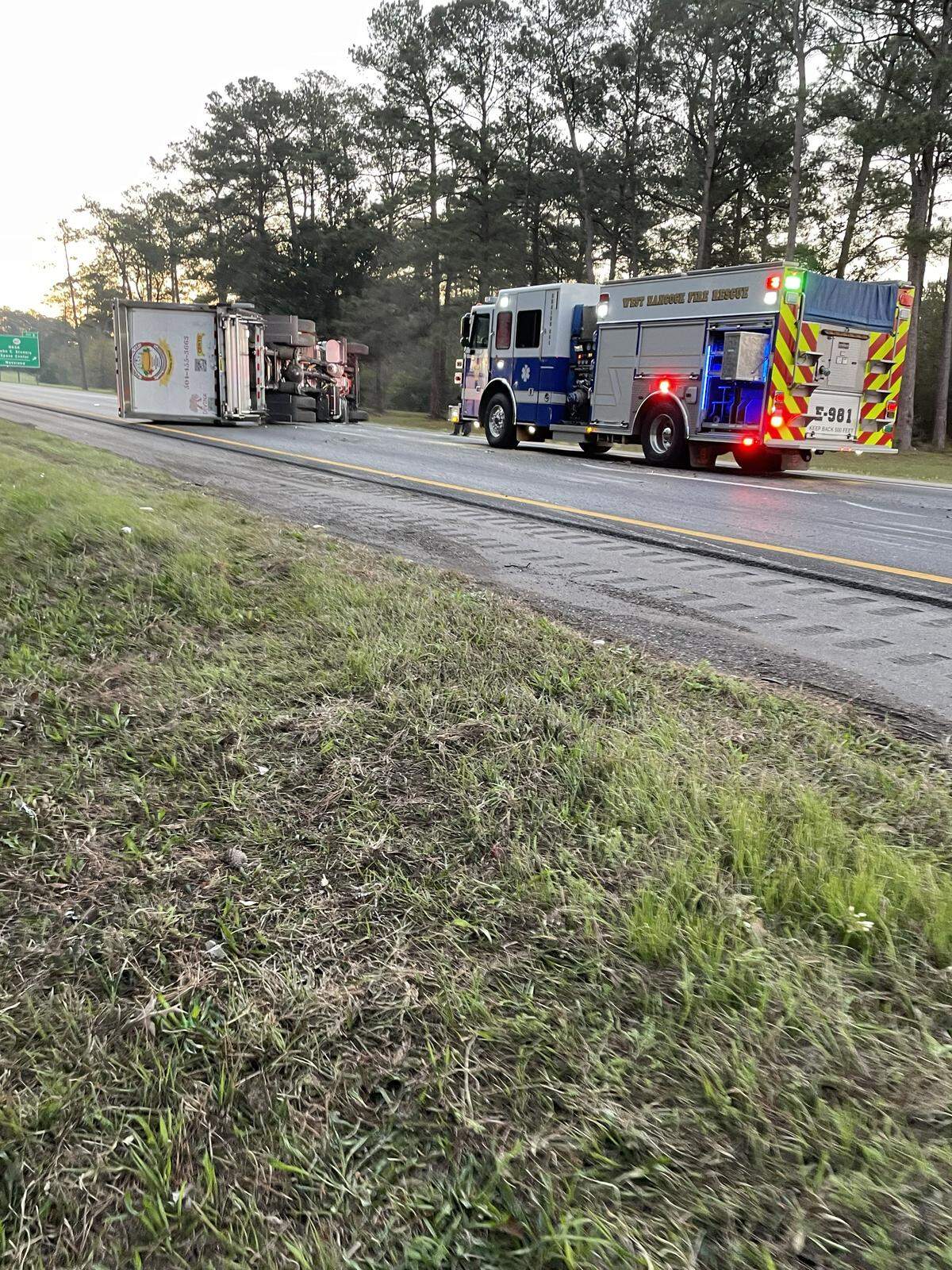 A box truck overturned on I-10 Friday in Hancock County, closing all eastbound lanes.